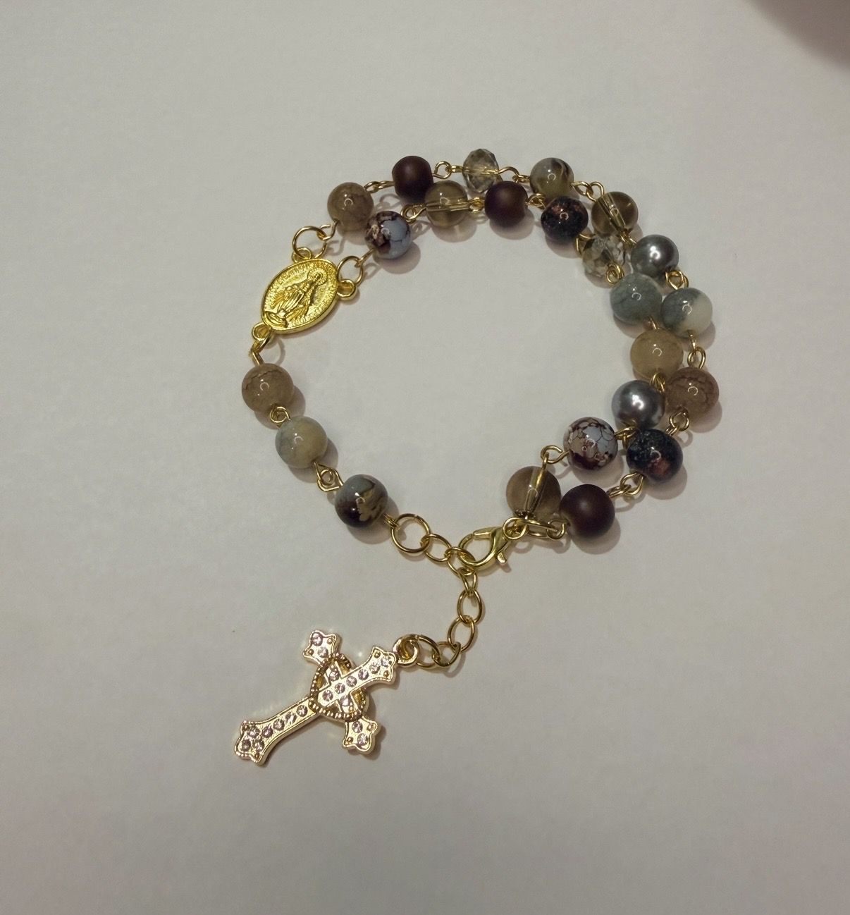 Coffee toned stone rosary bracelet in gold with Miraculous Medal and crystal cross