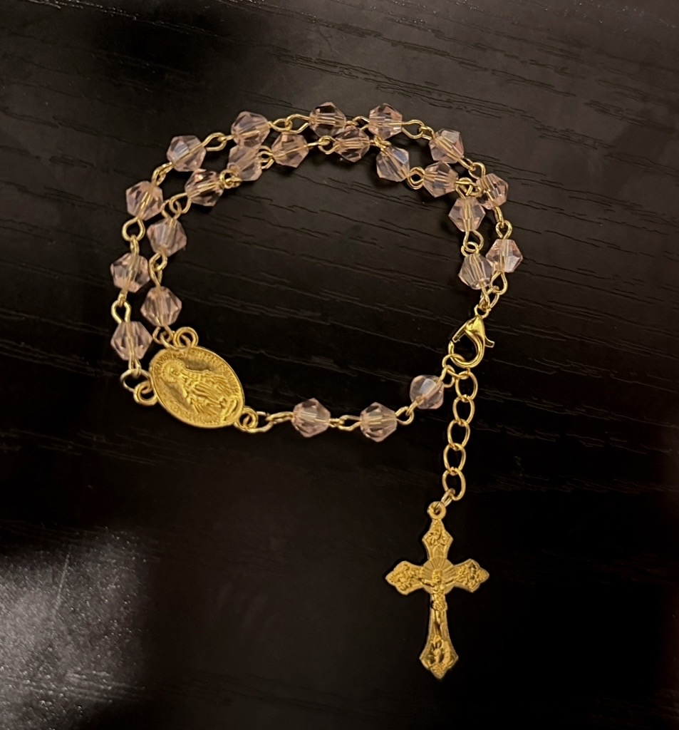Pink crystal rosary bracelet in gold with Miraculous Medal and gold crucifix